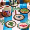 The Set Of 4 Icon Beaded Coasters Include An Eye, Cacti, Lips & Palm Tree - By Source Lifestyle UK